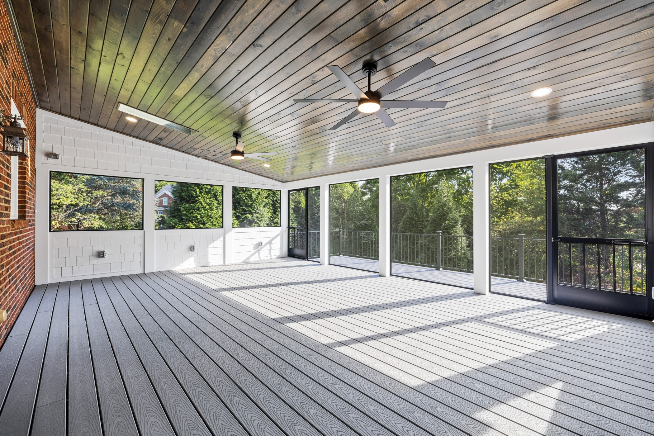 Amberset covered composite deck interior with black powder-coated stainless steel baluster railings